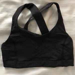 Black SoulCycle/LuluLemon cross branded sports bra